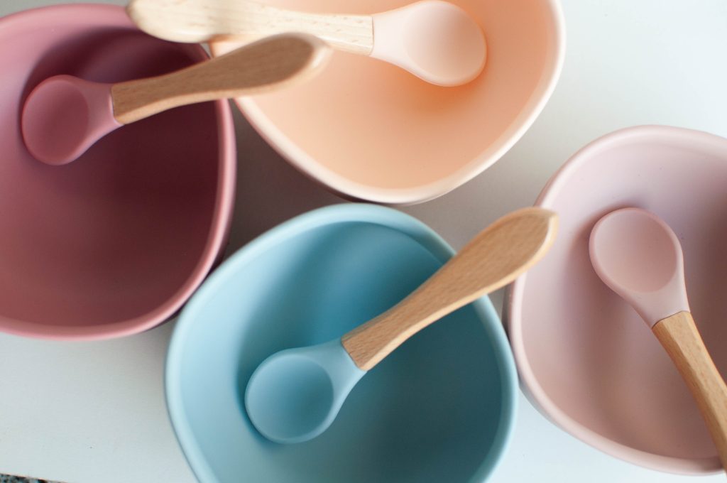 Group of colorful bowls and spoons