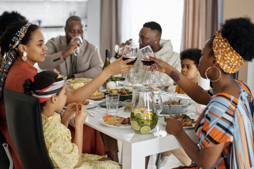 Toasting wine glasses at a family meal