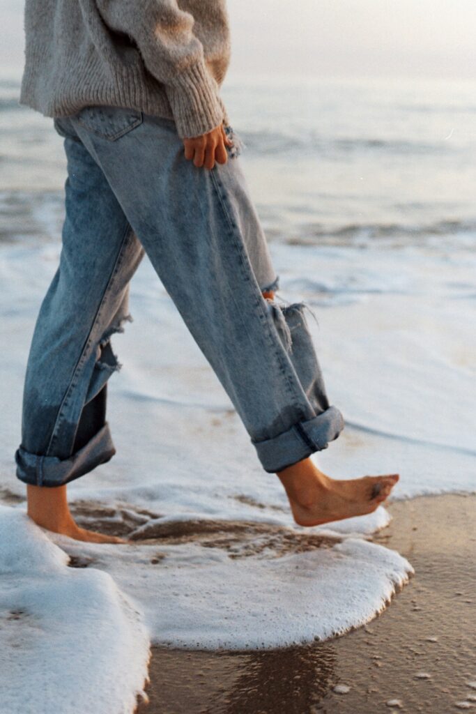 Person walking along the beach