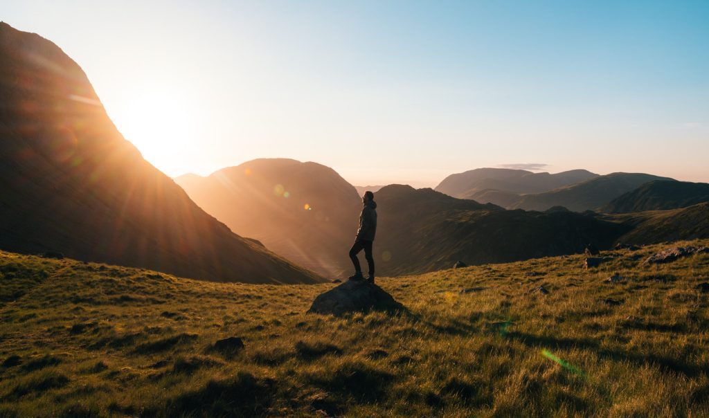 Hiker watching the sunrise