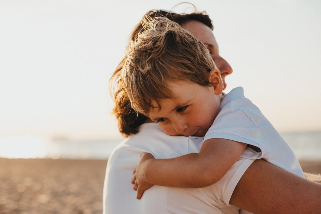 Mother holding young boy